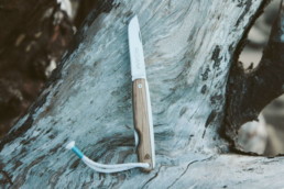 the James brand knife propped up on rock