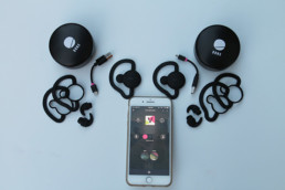 bonx earbuds next to phone