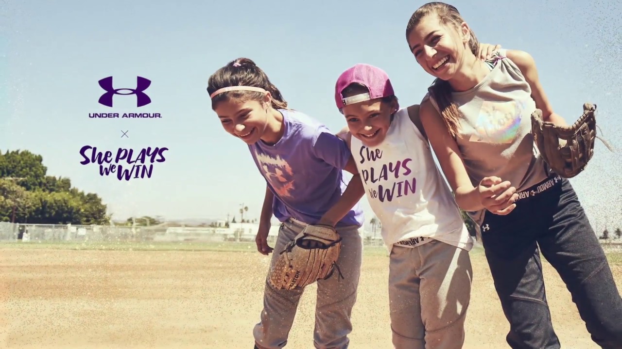 under armor ad with three female baseball players