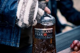highland park bottle being opened by women