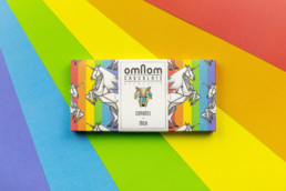 Rainbow colored chocolate bar on rainbow background